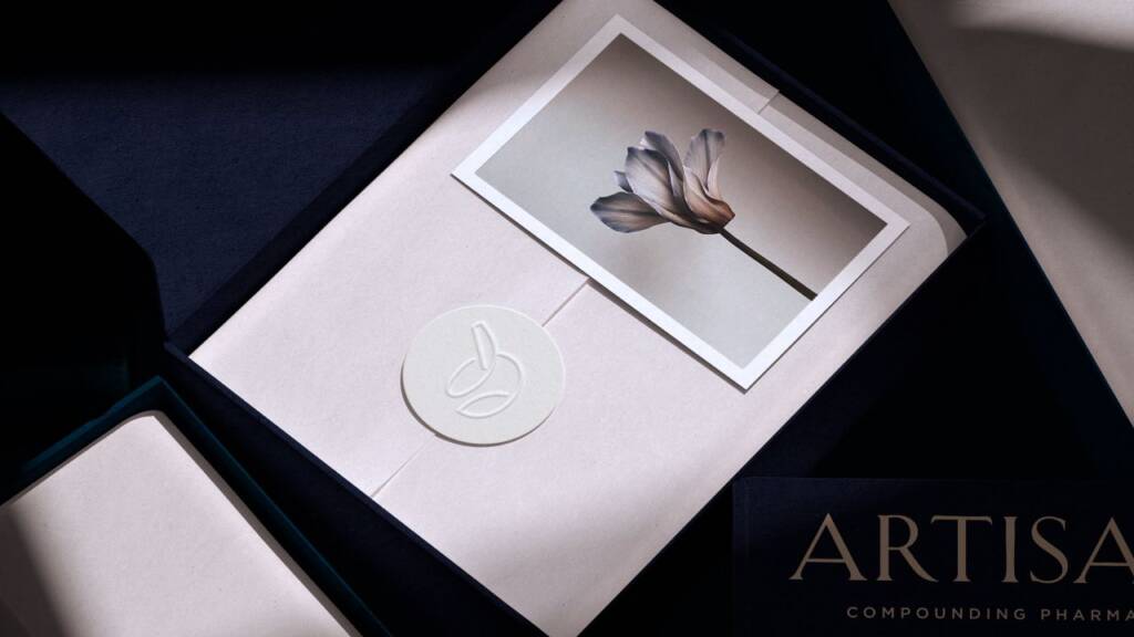 Sticker design for a compounding pharmacy featuring an embossed seal sticker, custom mortar and pestle logo design, and luxury pharmacy packaging presentation.