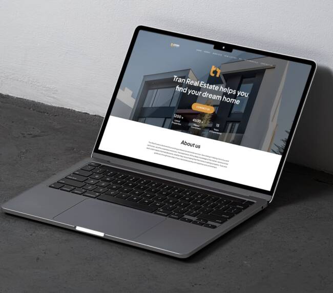 Real estate landing page design mockup displayed on a laptop screen, showcasing a custom homepage layout with property imagery, headline section, and professional real estate branding.